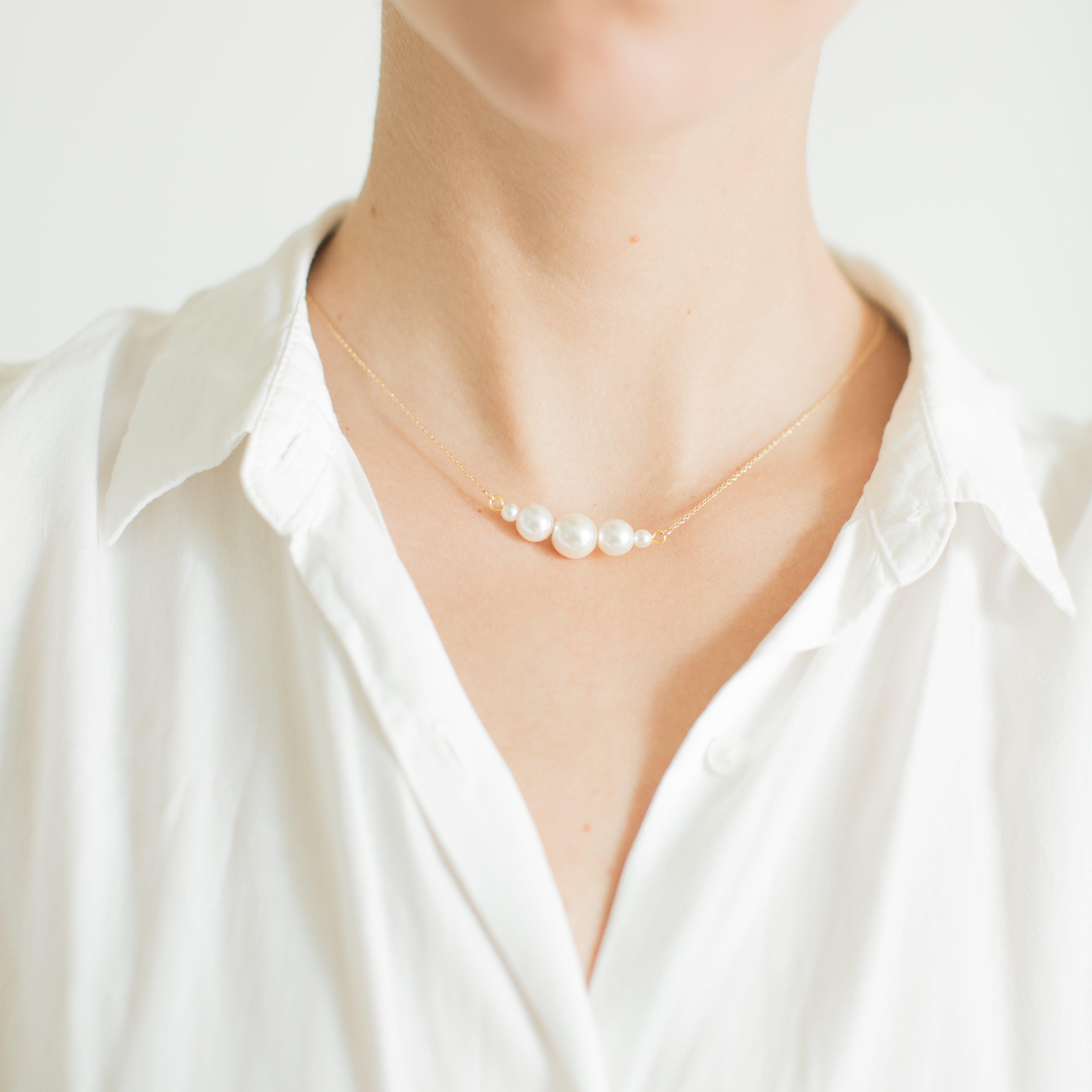 Delicate gold white pearl necklace