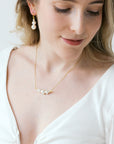 Delicate gold white pearl necklace