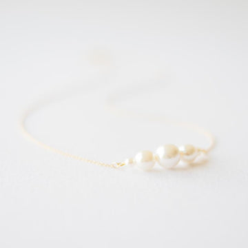 Delicate gold white pearl necklace