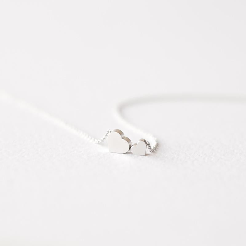 Delicate two silver hearts necklace